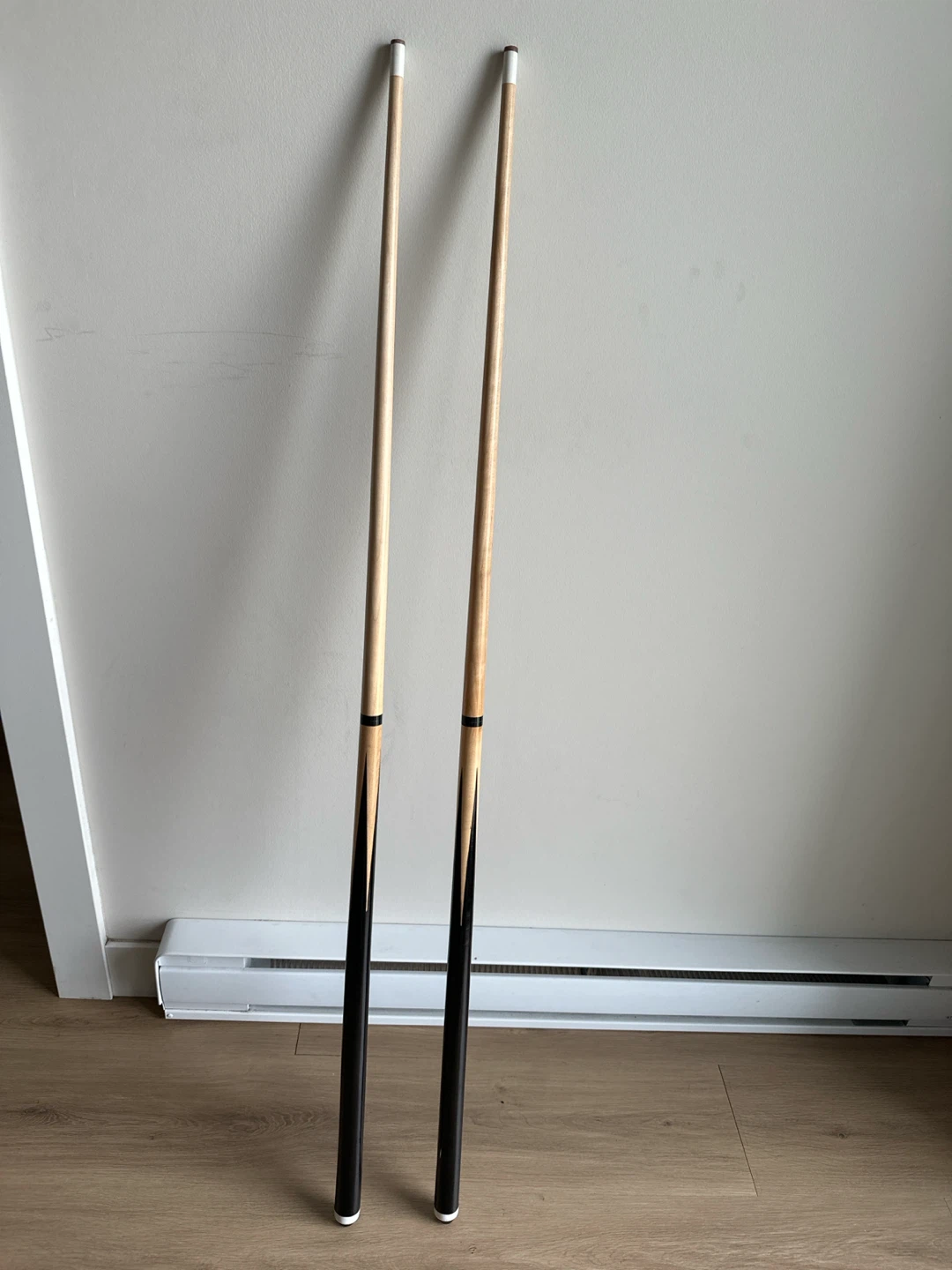 Two Wooden Pool Cues