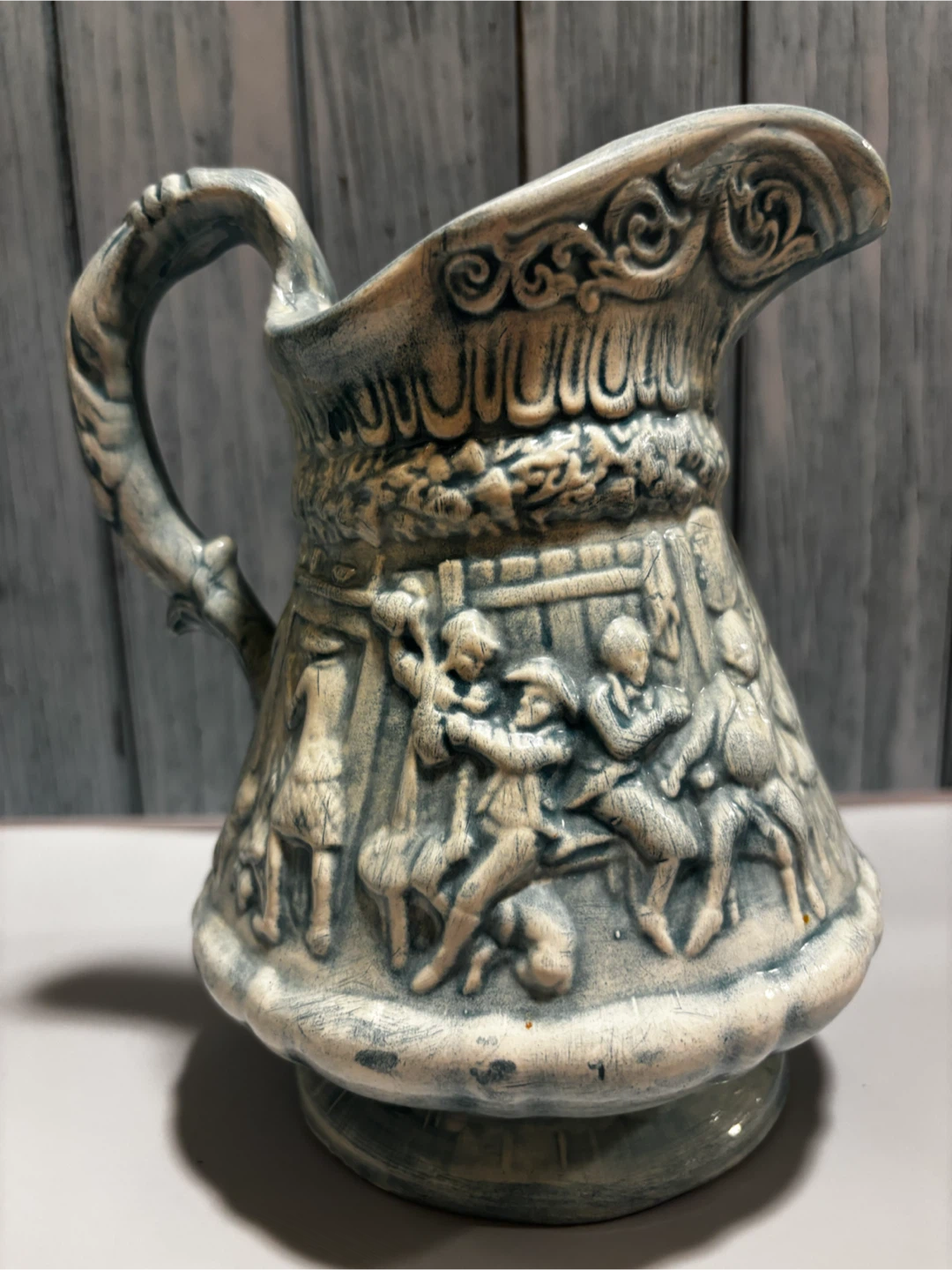 Vintage Ceramic Pitcher with Embossed Scene