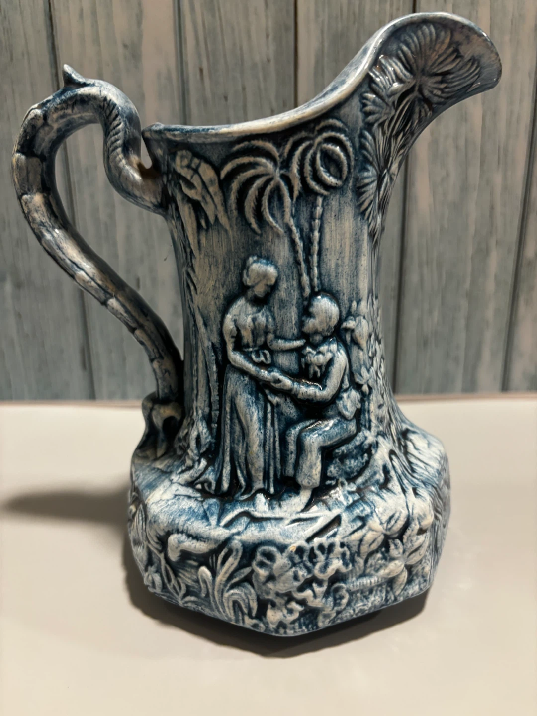 Blue Decorative Pitcher with Embossed Scene