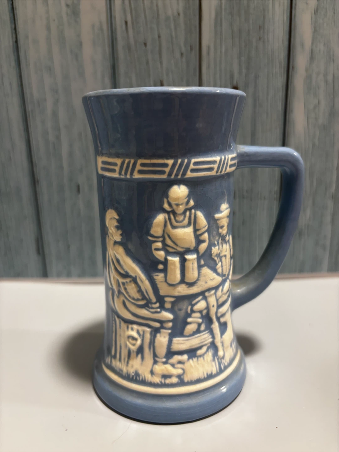 Blue Ceramic Mug with Relief Scene