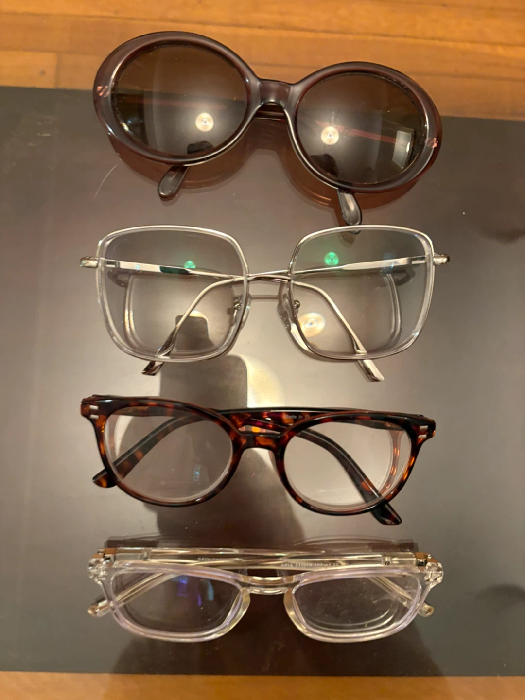 Four Pairs of Eyeglasses and Sunglasses