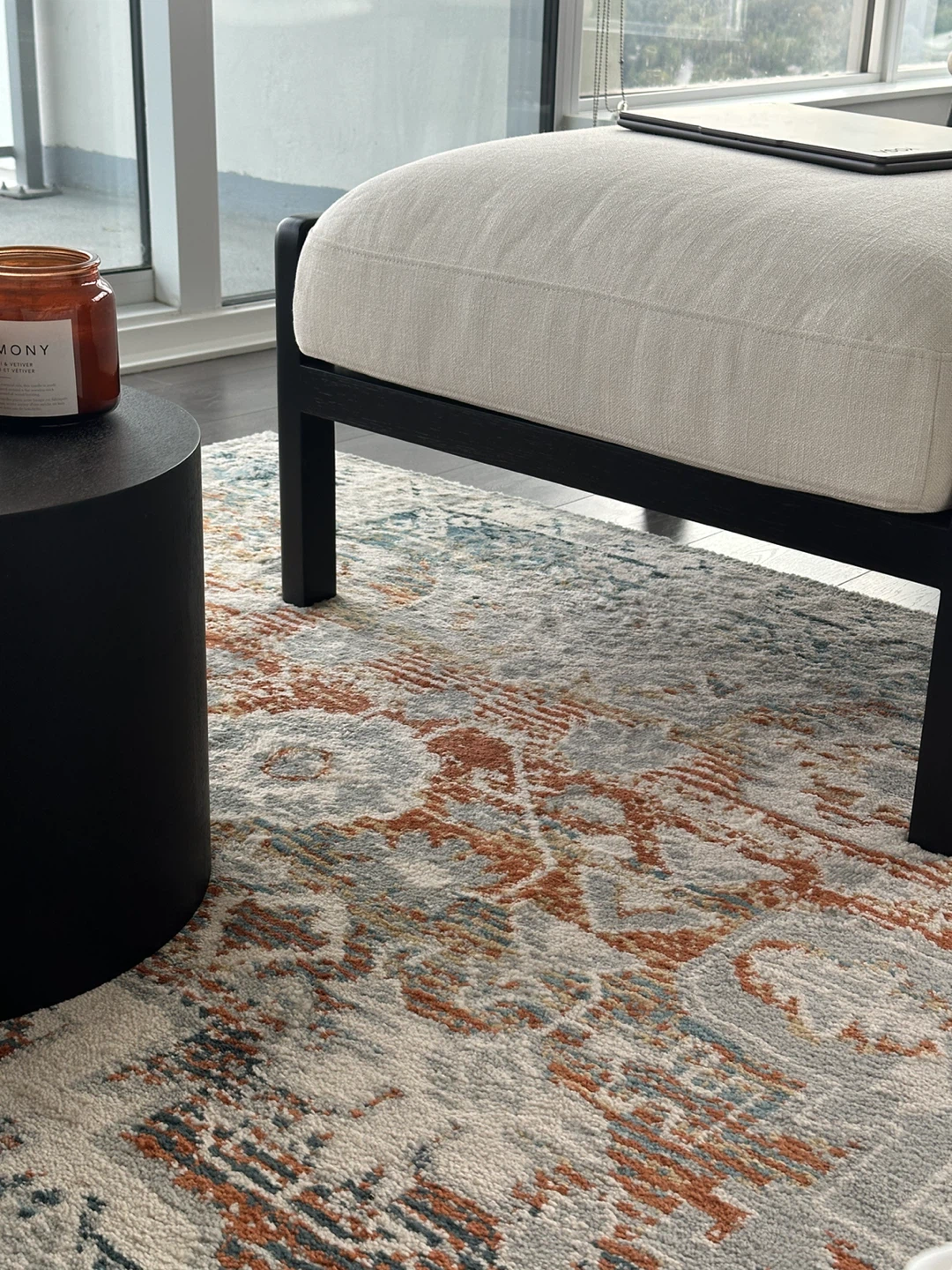Upholstered Ottoman with Rattan Detailing