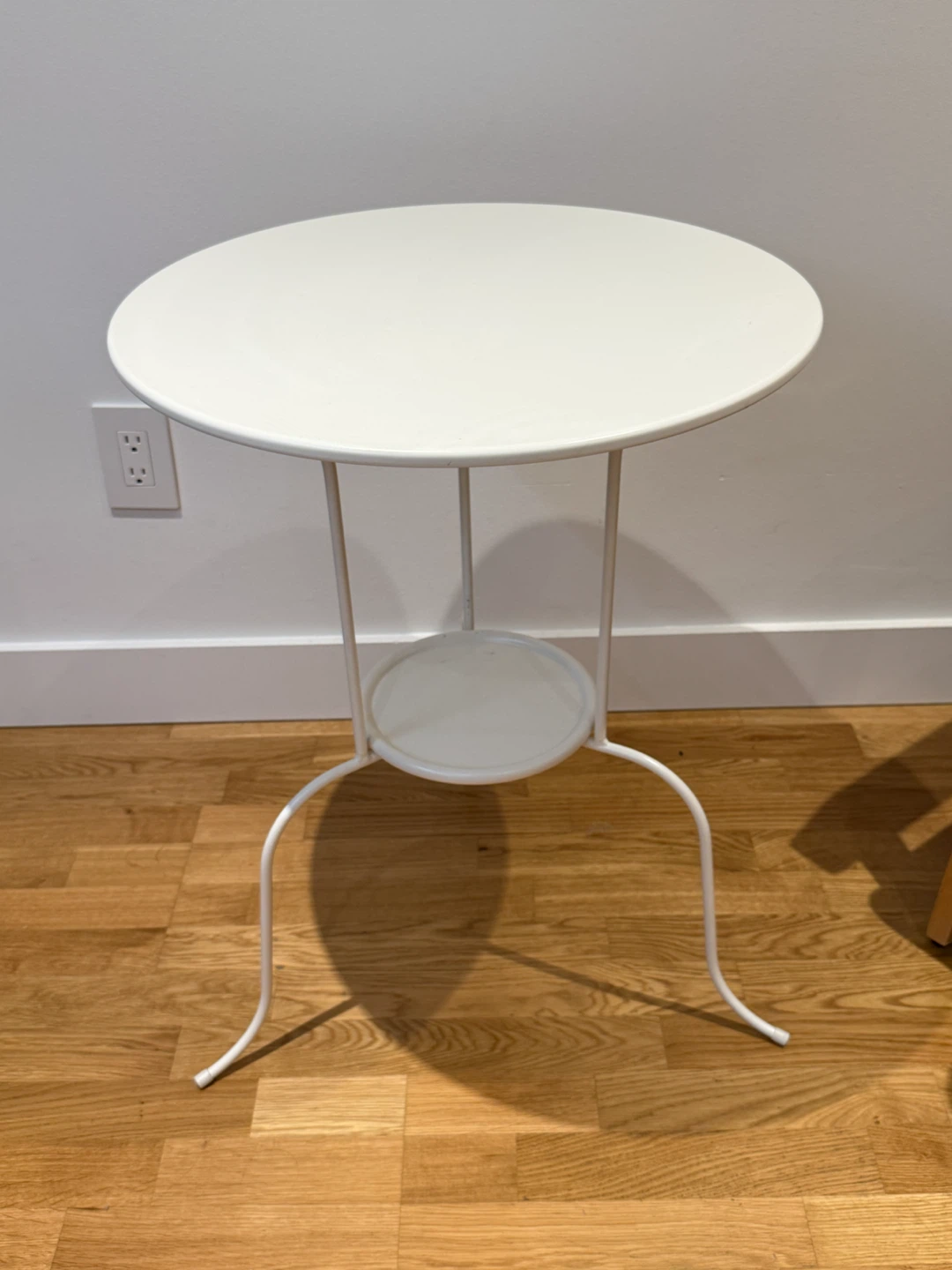 White metal side table with lower shelf