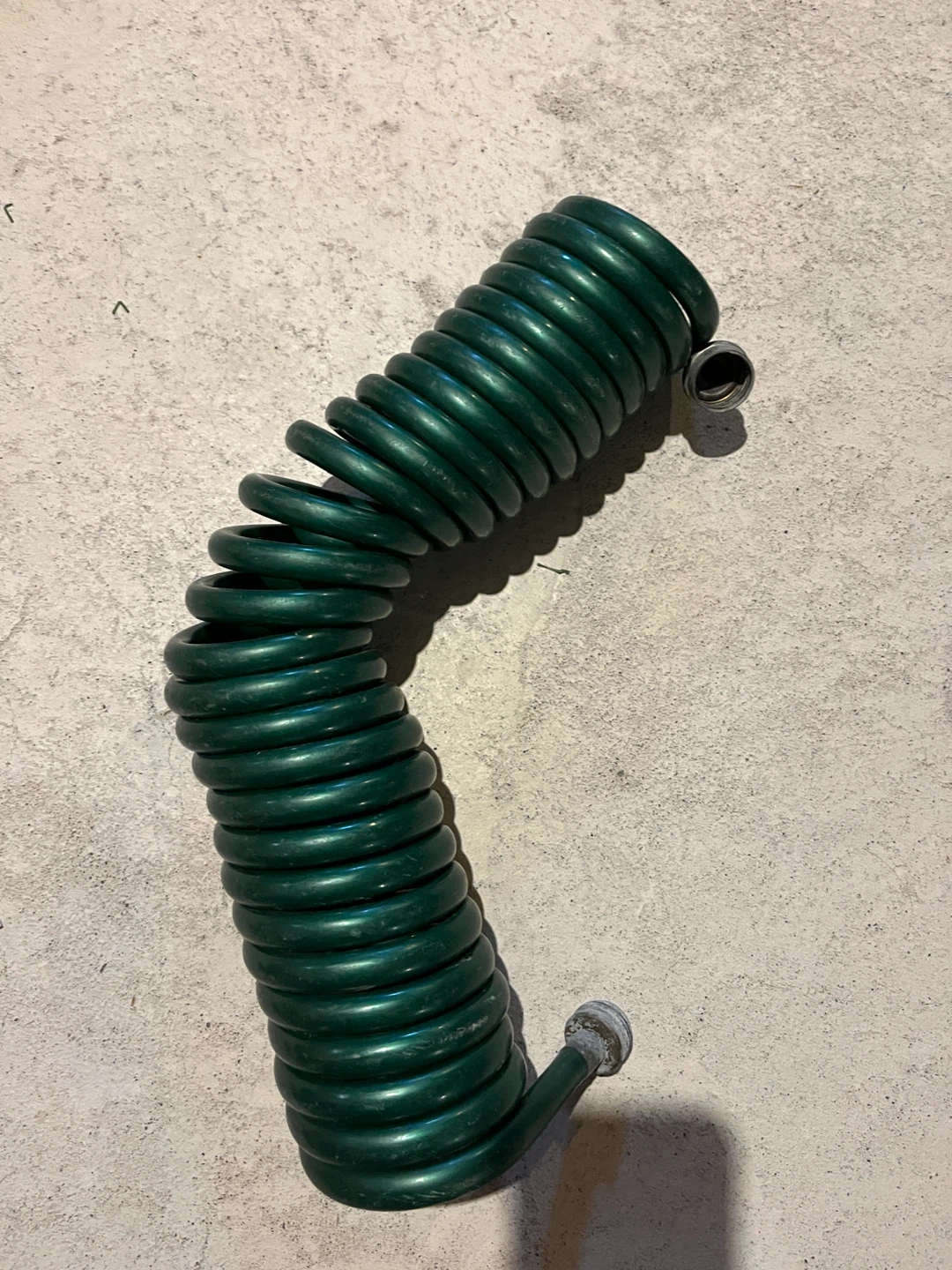 Green Coiled Garden Hose