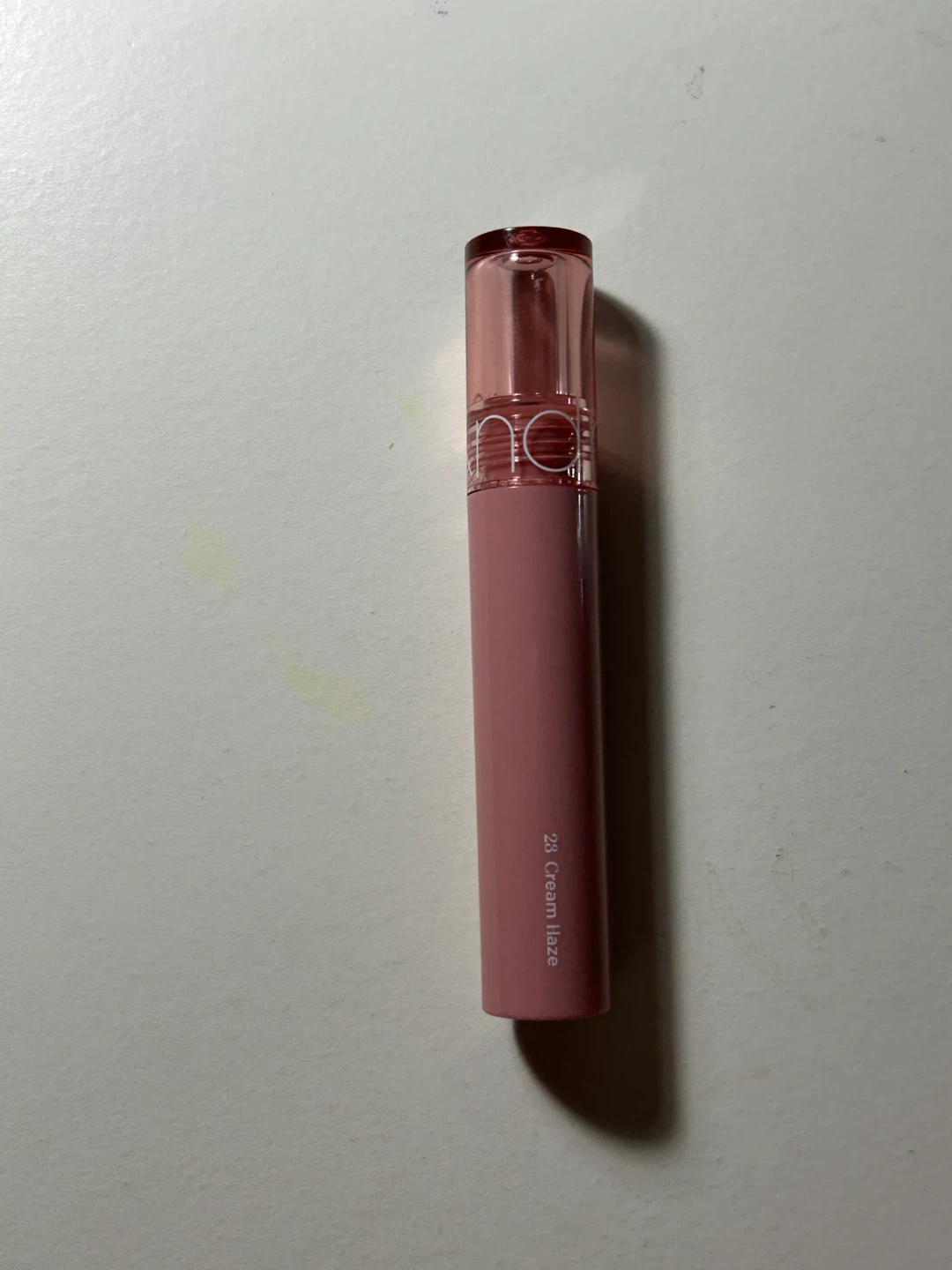 rom&nd gloss 23 cream haze