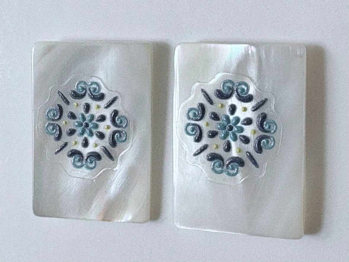 Mother of Pearl pierced earrings with blue design
