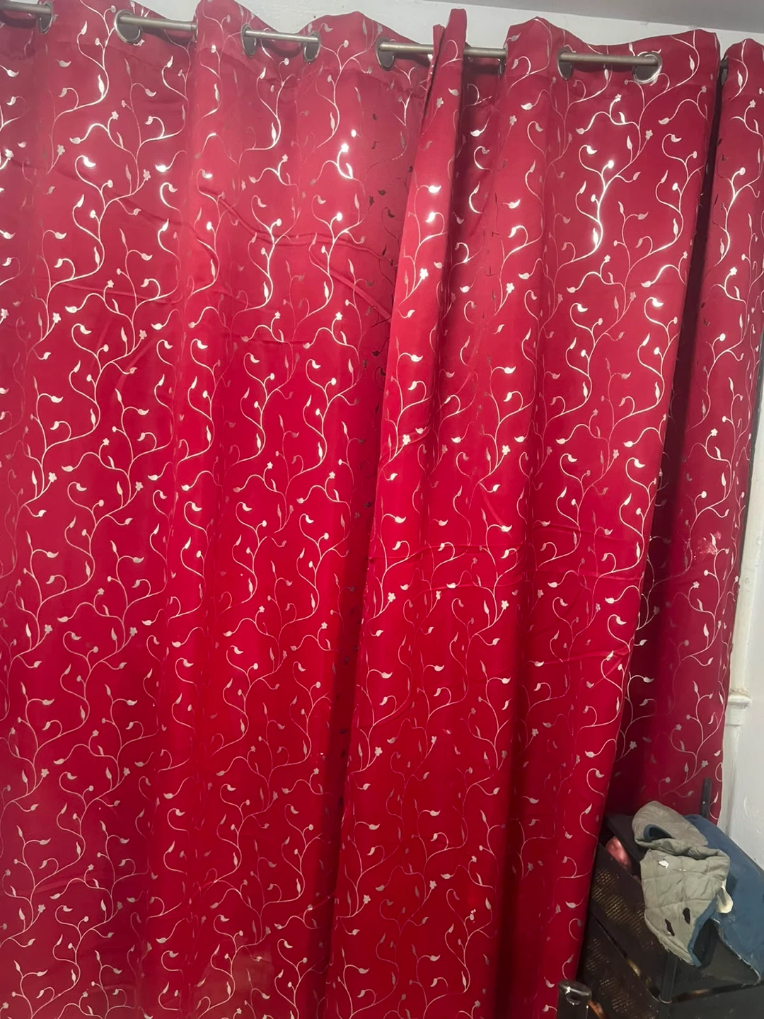 Red decorative curtains with silver vine pattern