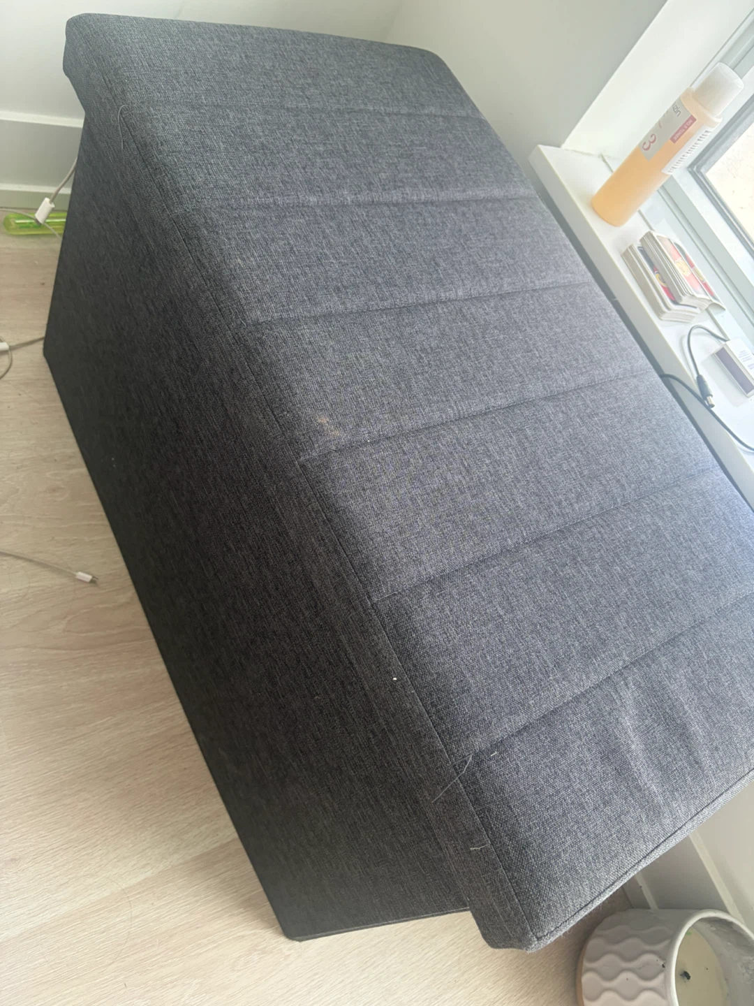 Grey upholstered storage ottoman bench