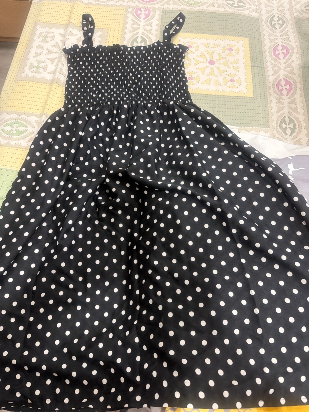 Black polka dot smocked dress