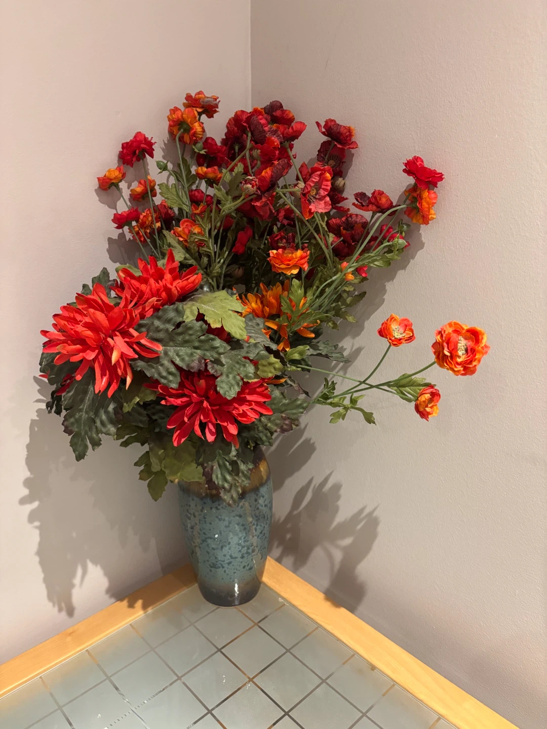 Artificial Floral Arrangement in Blue Speckled Vase