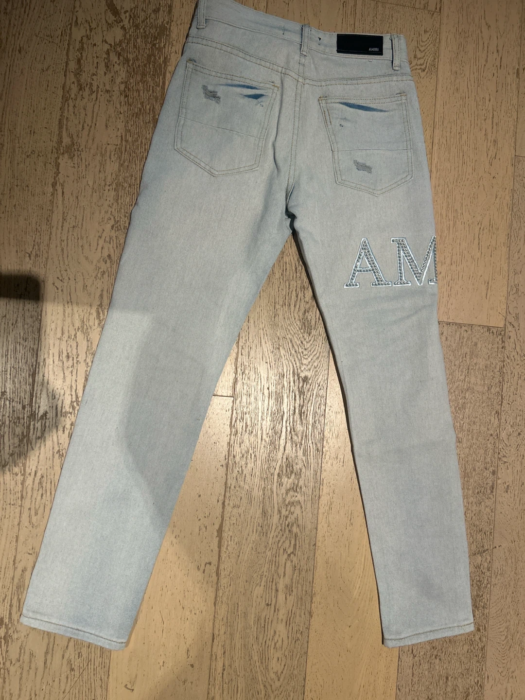 AMIRI Light Wash Distressed Jeans - photo 2