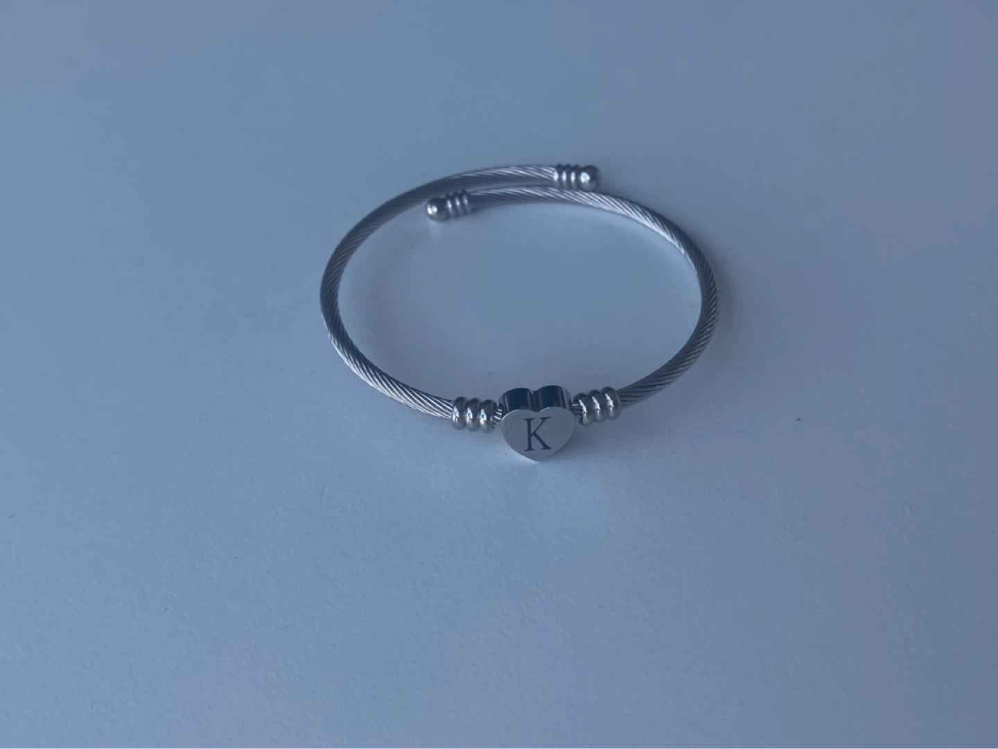 Silver tone heart "K" initial cable wire bangle bracelet