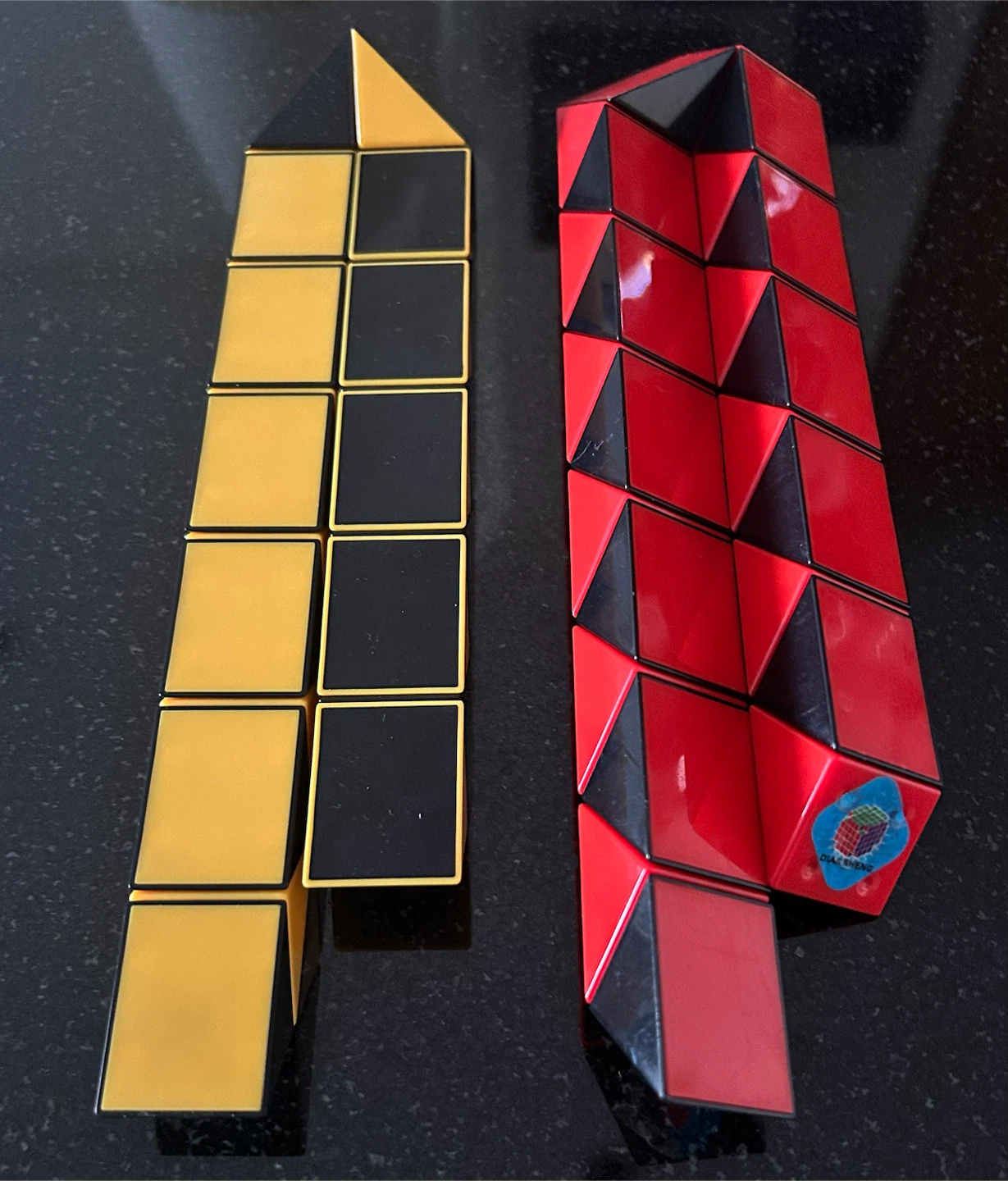 Rubik's Snake Puzzle Toy - Red, Black, Yellow