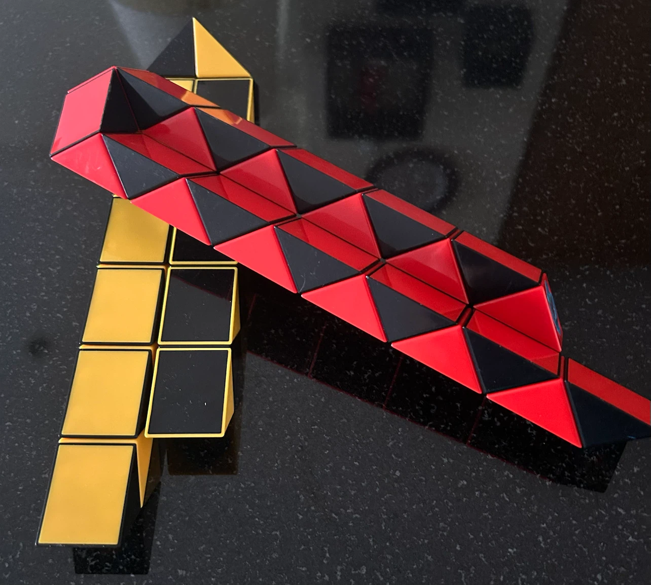 Rubik's Snake Puzzle Toy - Red, Black, Yellow - photo 2