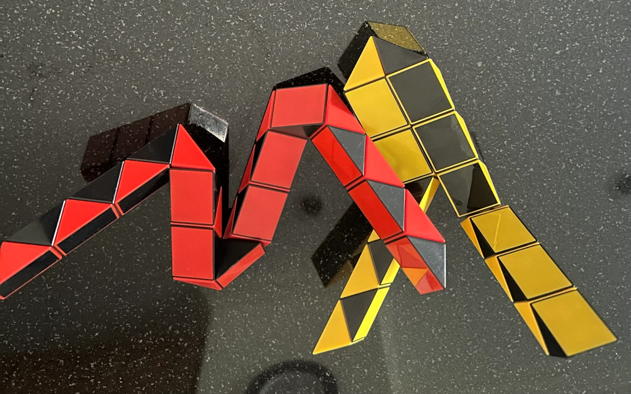 Rubik's Snake Puzzle Toy - Red, Black, Yellow - photo 3