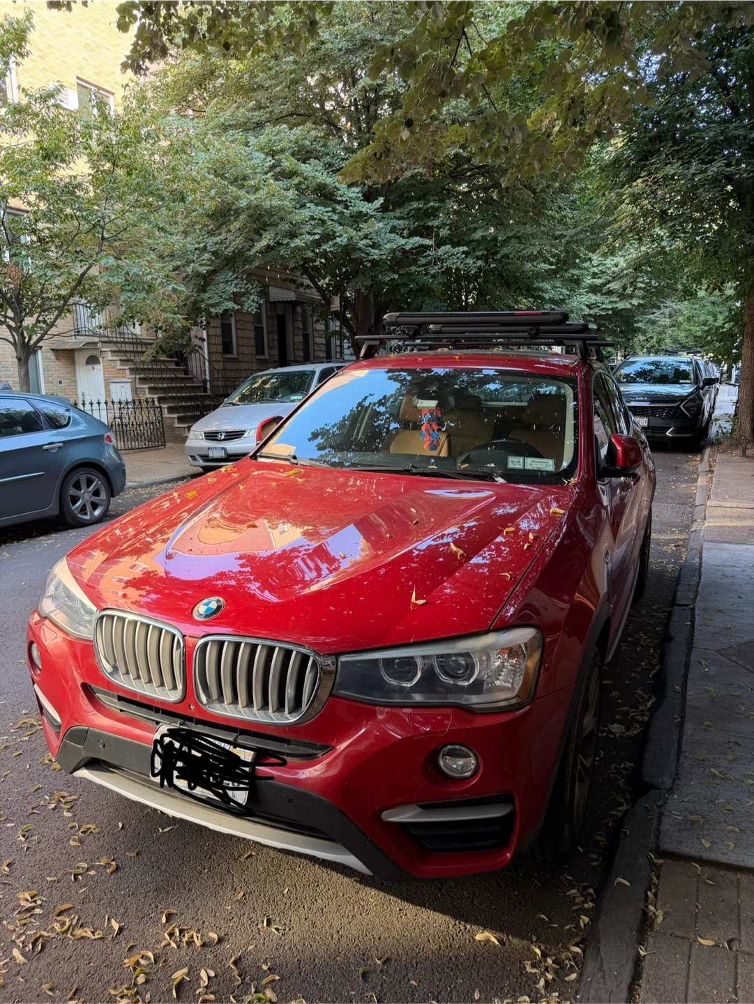 Red BMW X4 with Roof Rack