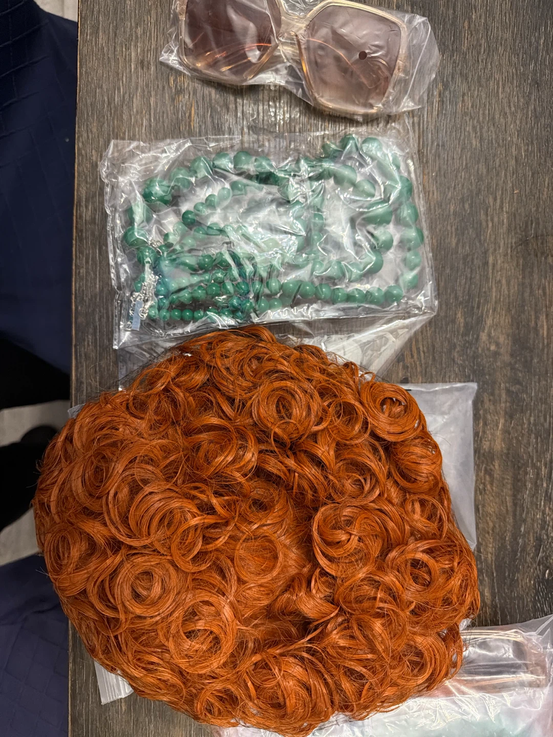 Orange Curly Wig with green gem necklace