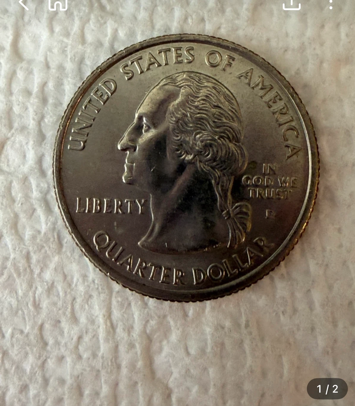 Alaska State Quarter and UK 10 Pence Coin