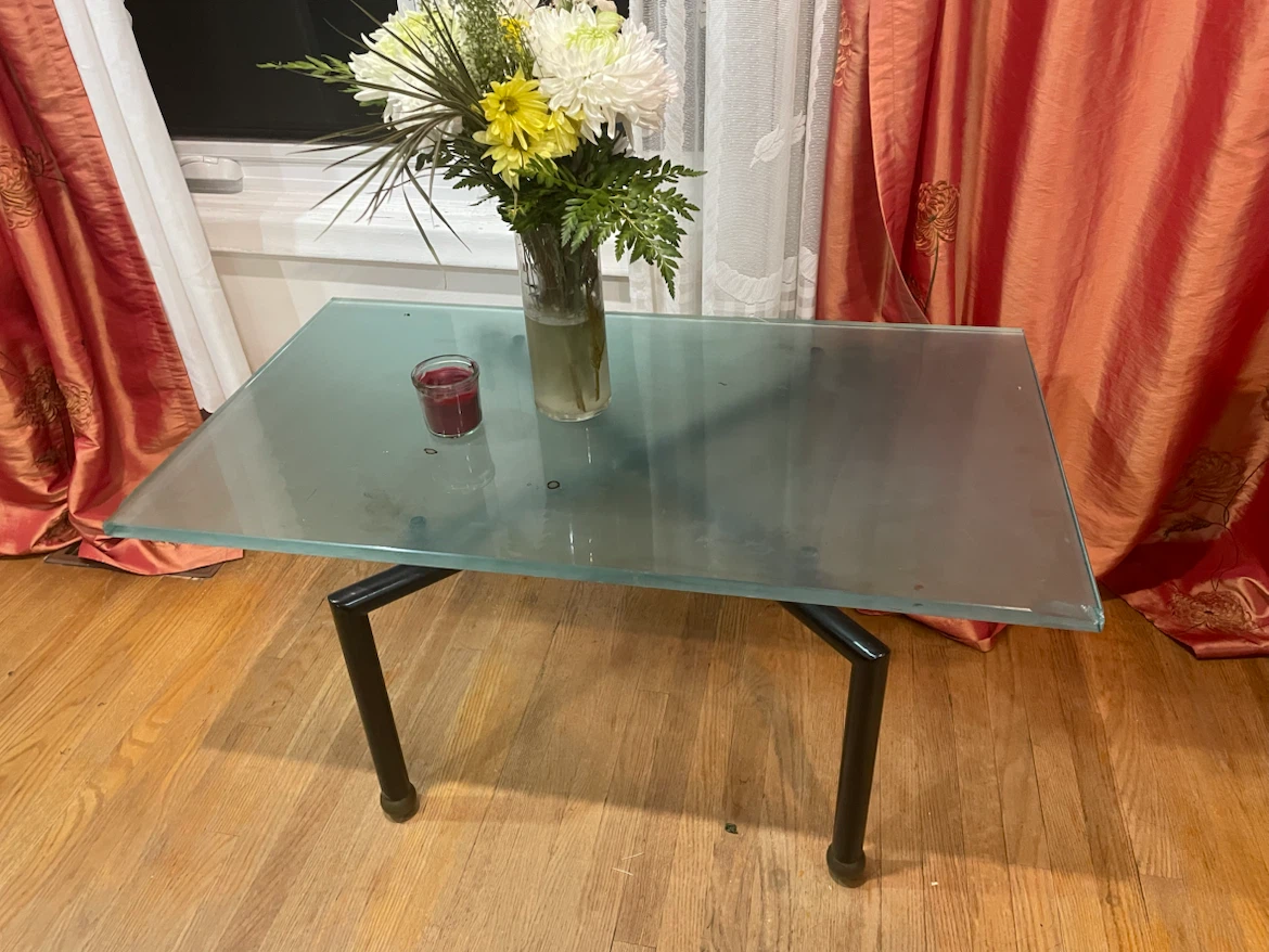 Glass top side table with metal legs