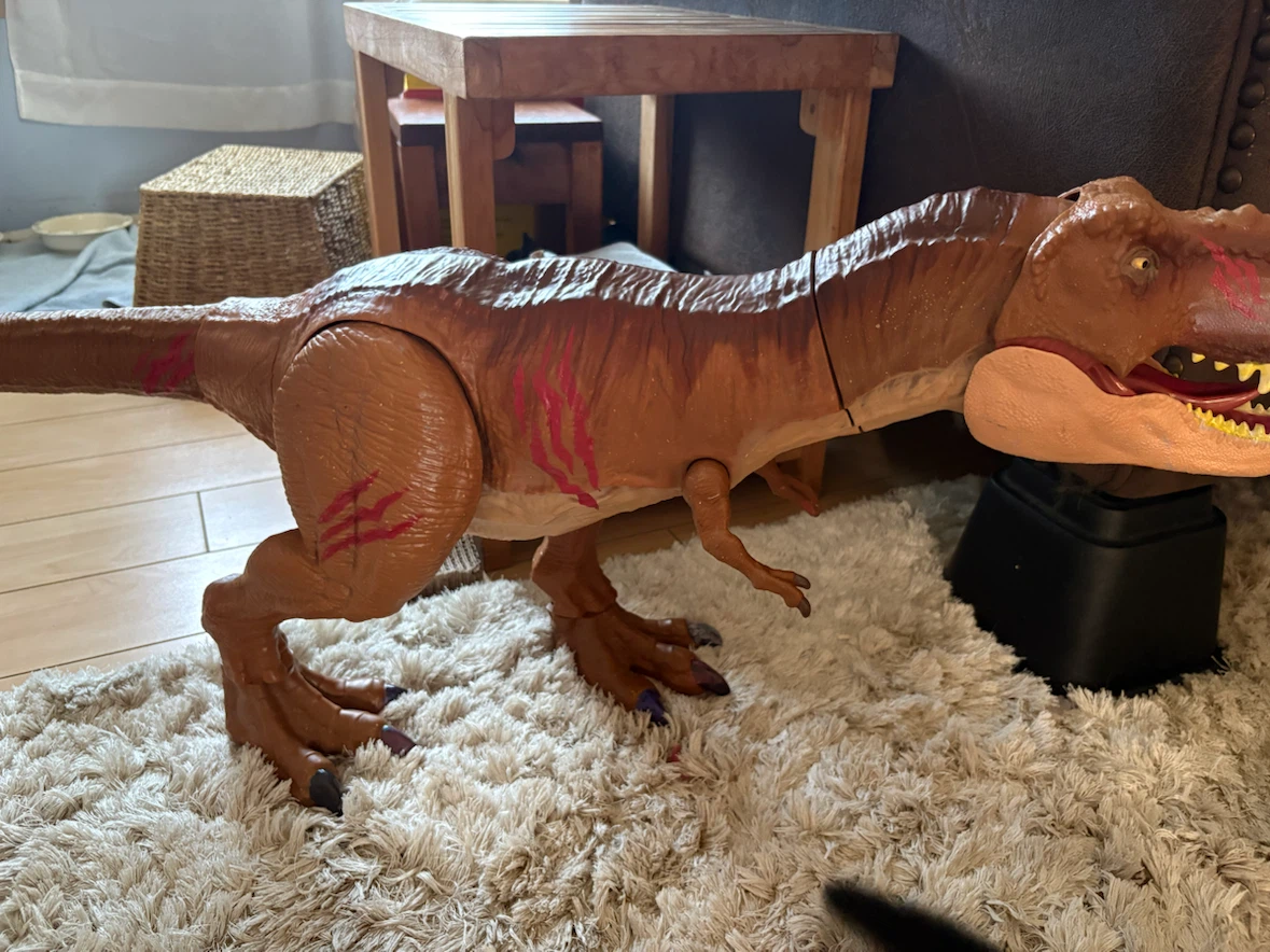 Large Brown Dinosaur Toy with Red Markings