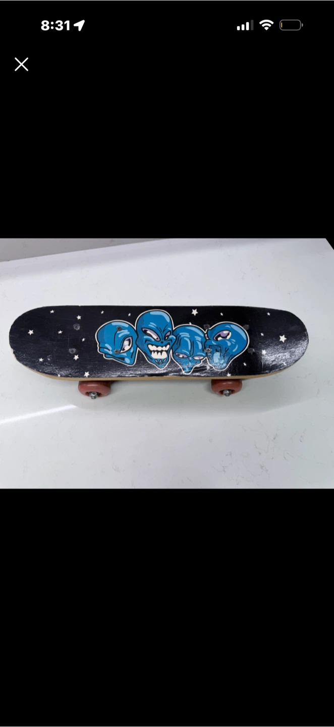 Vintage Skateboard with Alien Graphics