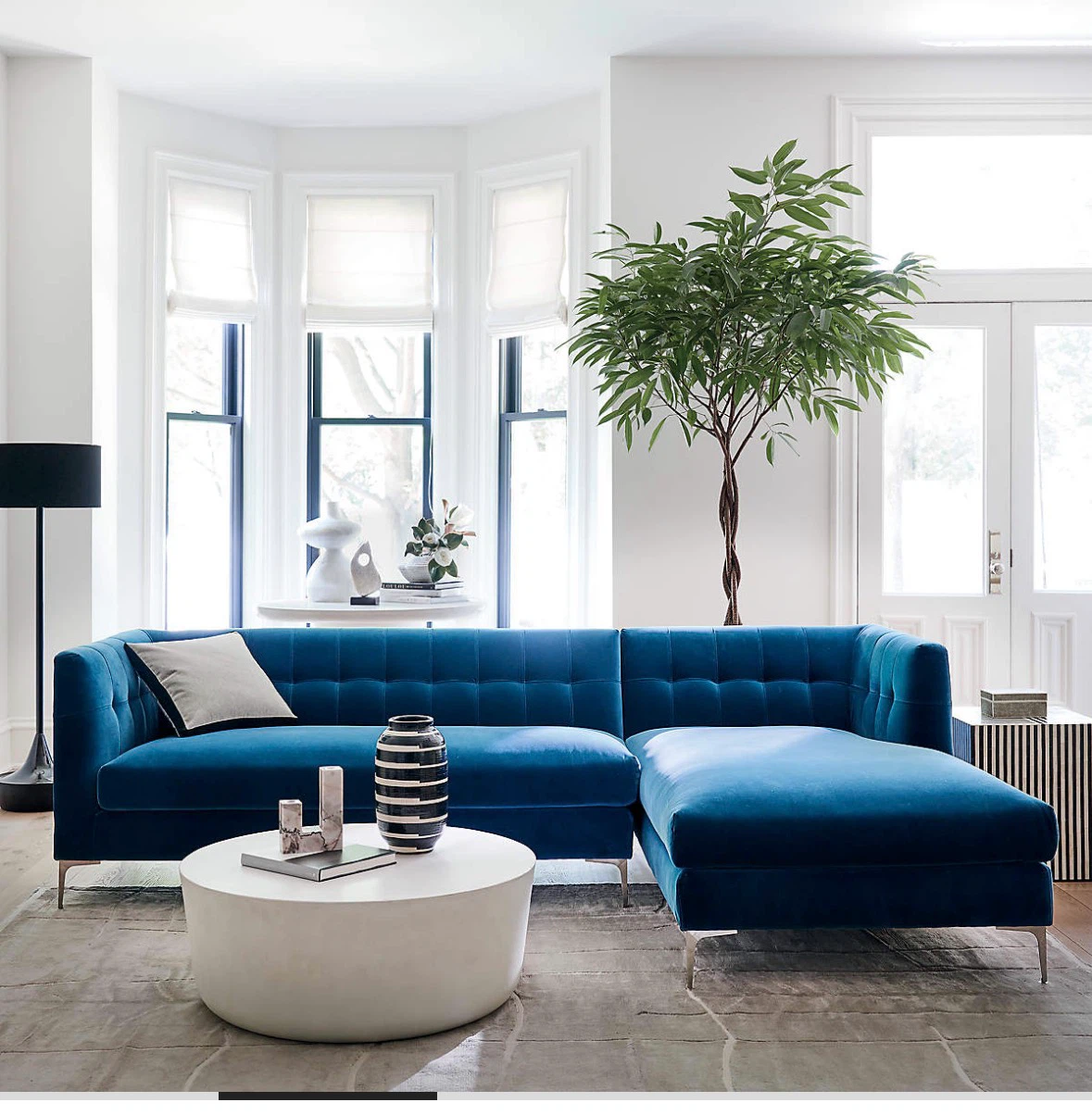 CB2 Blue Velvet love seat only left part