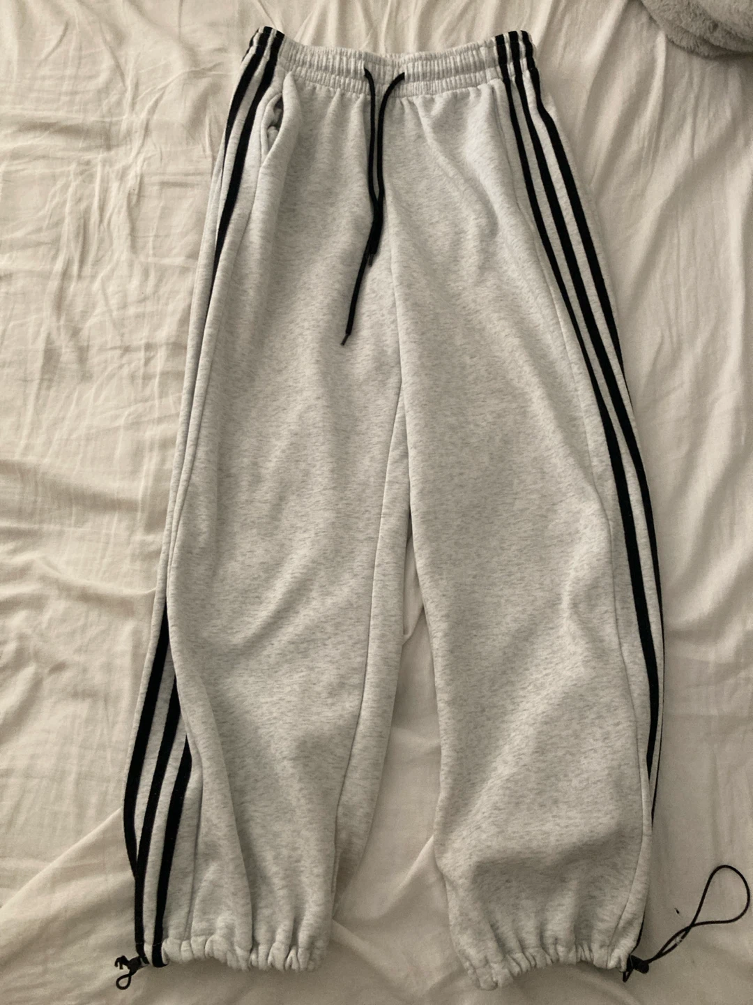 grey/white and black track pants