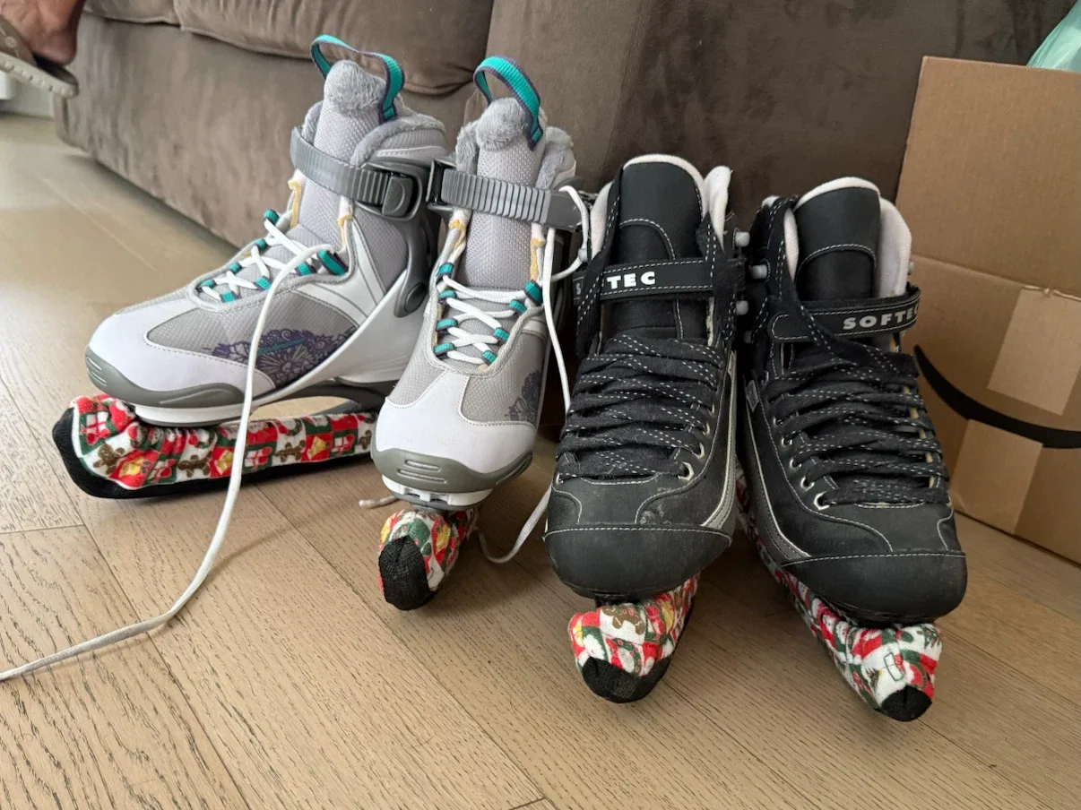 Pair of Ice Skates with Blade Covers