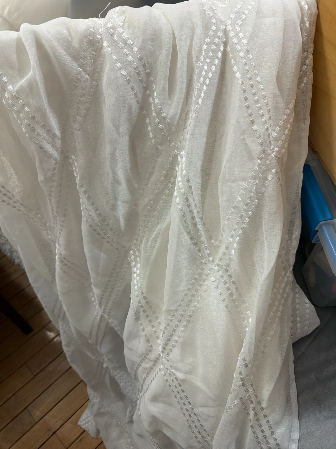 White sheer curtain with decorative diamond pattern
