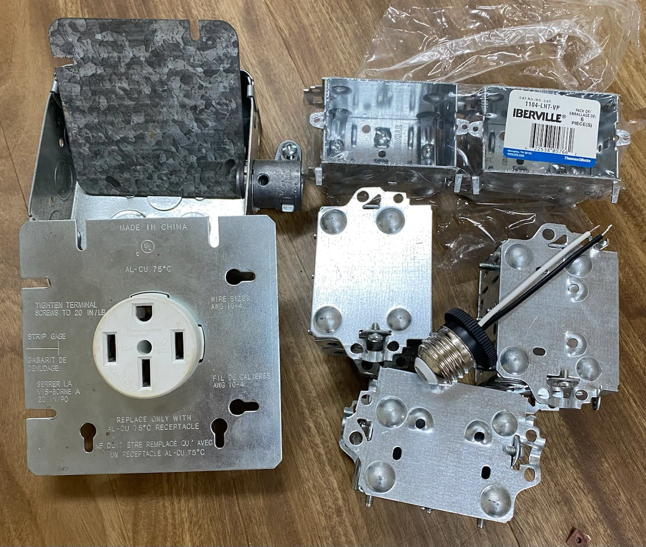Electrical outlet box and fixtures
