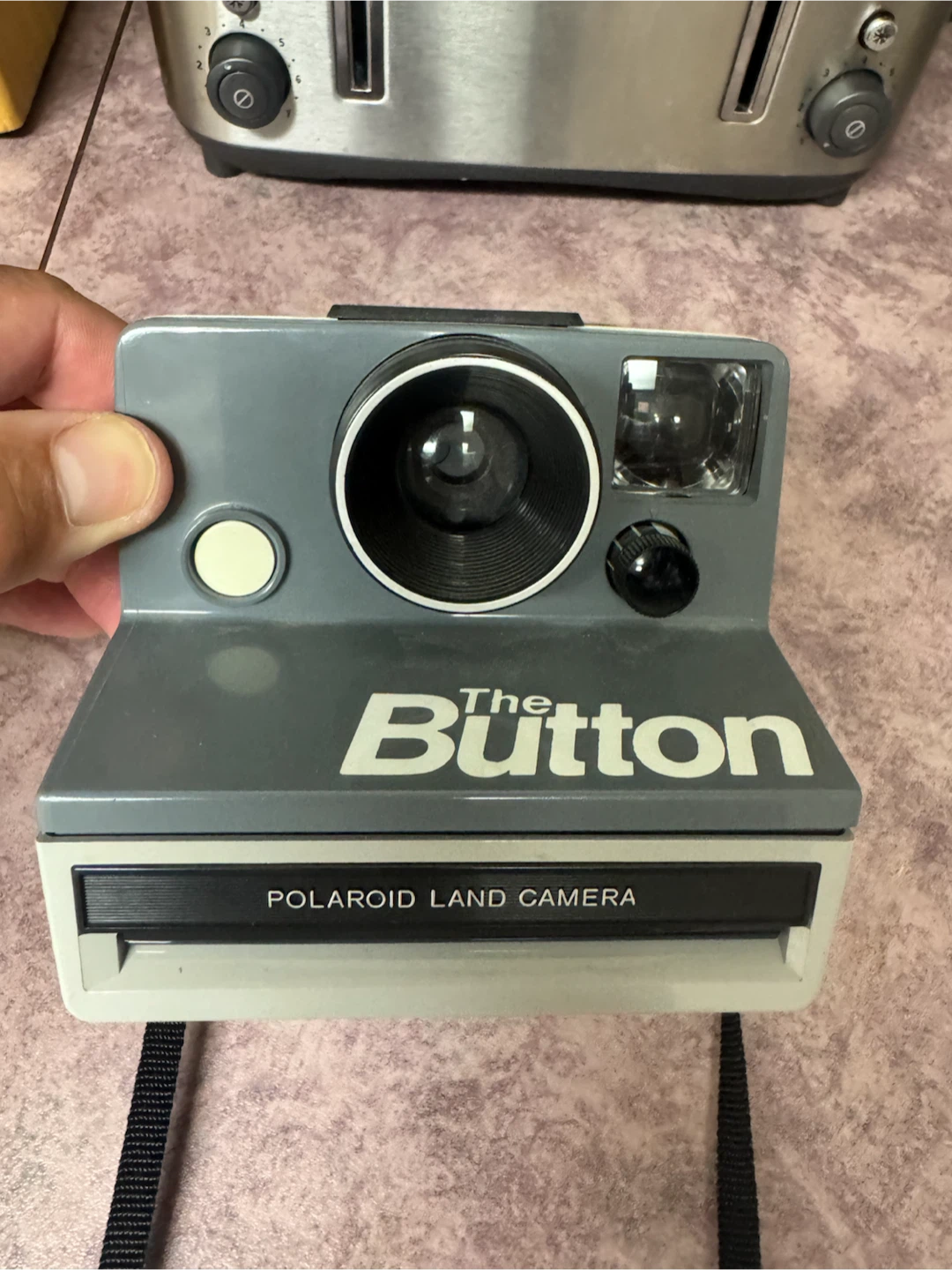 The Button Polaroid camera