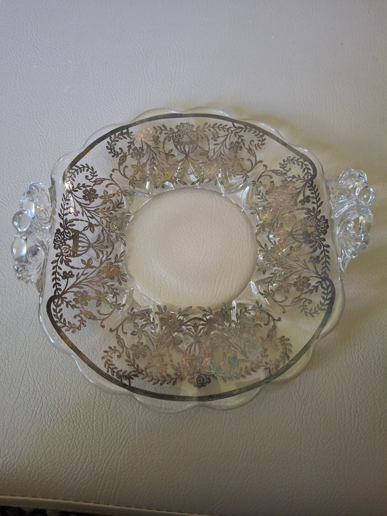 Serving plate with detailed silver flower design