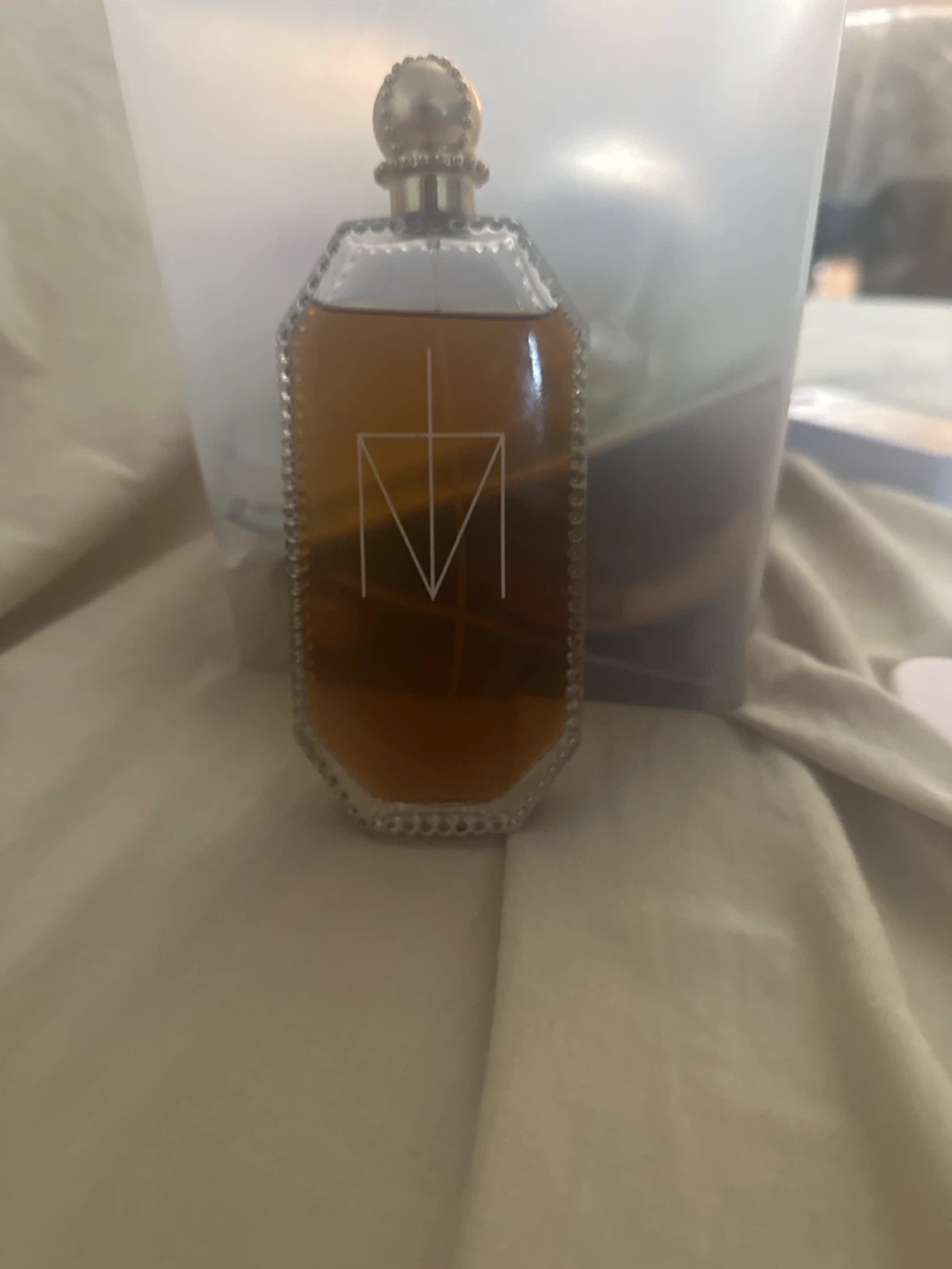 Vintage Perfume Bottle with Embossed Logo