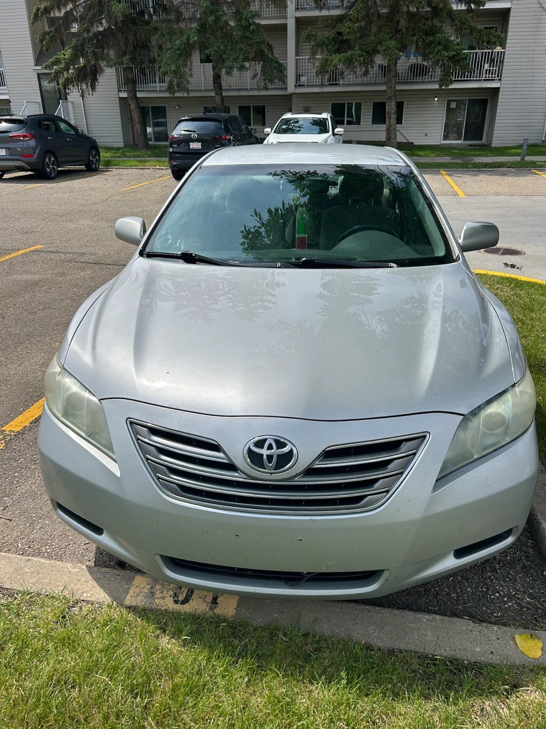 Silver Toyota Camry Hybrid Sedan
