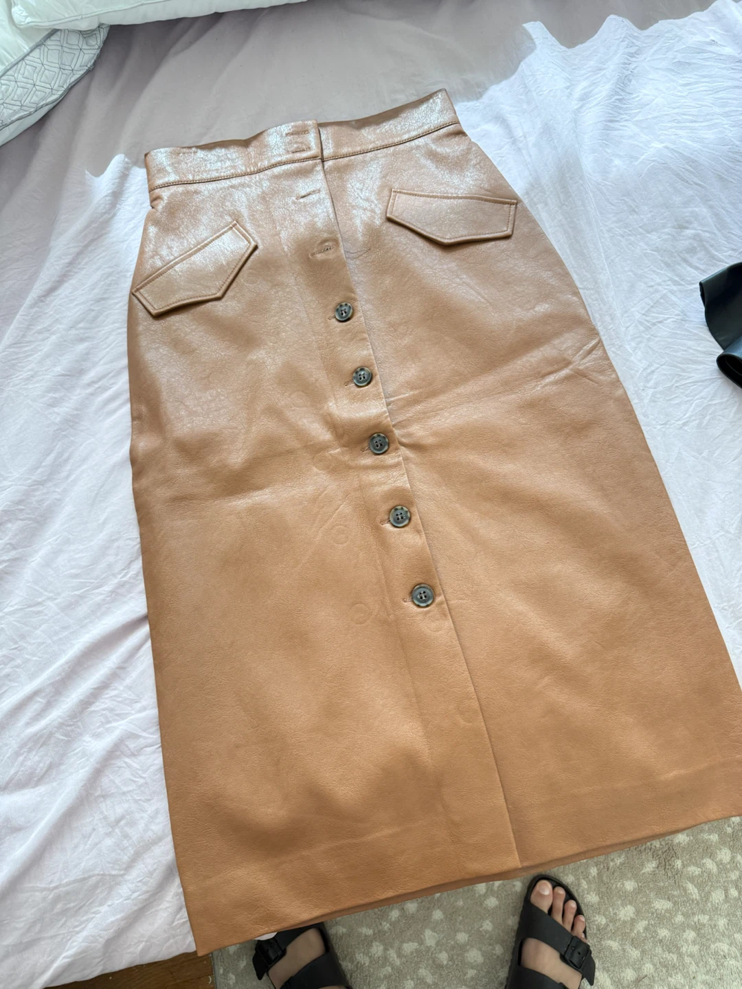 Mango black leather skirt and h&m tan leather skirt