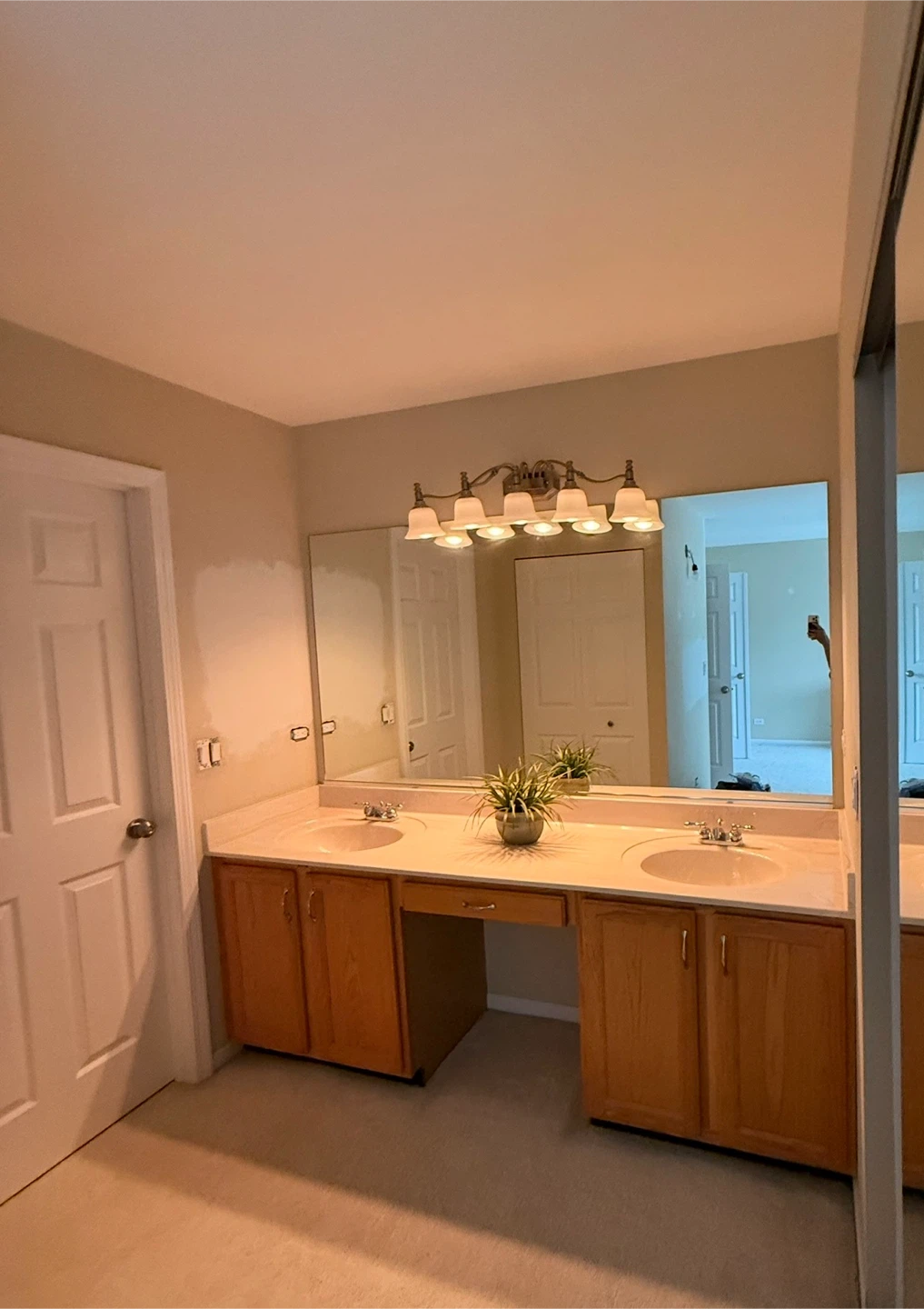 Merillat cabinetry w/mirror faucets and light
