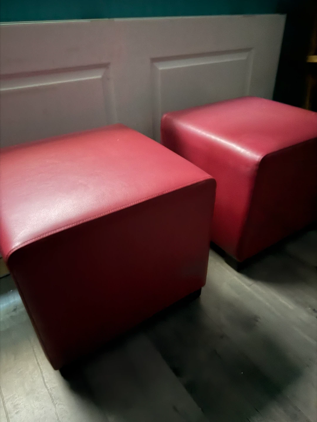 Pair of red faux leather cube ottomans
