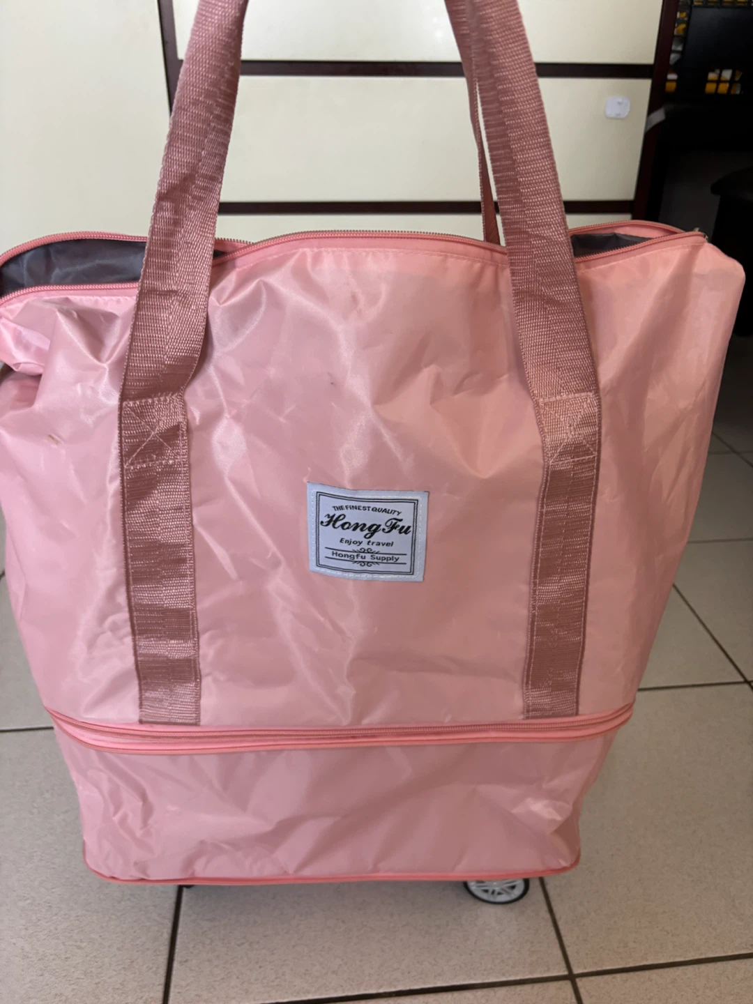 Hong Fu Pink Rolling Duffle Bag