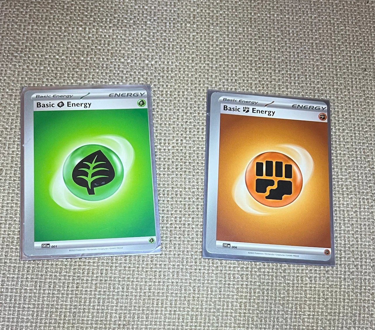 Two rare miss cut Pokemon cards