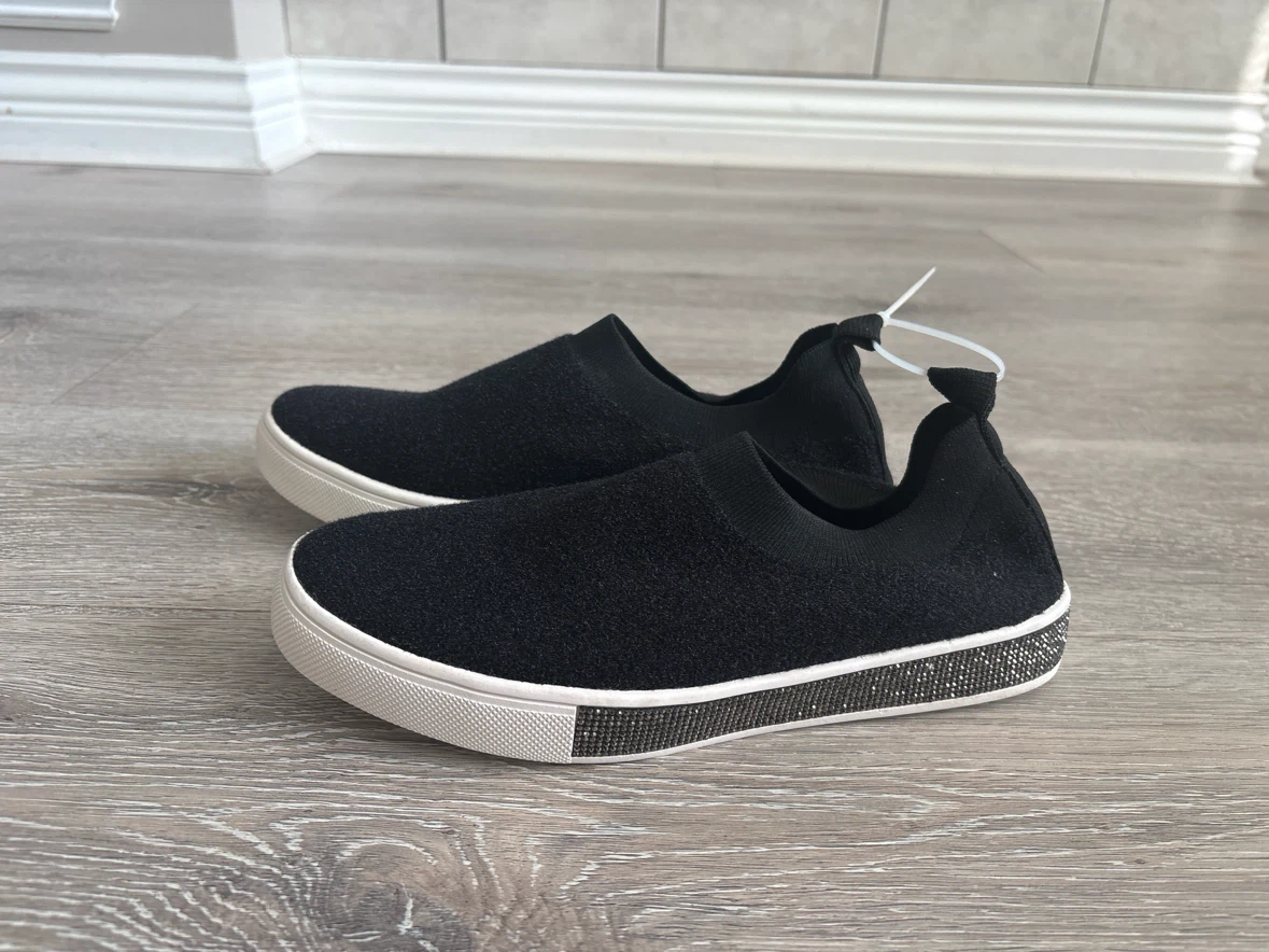 Black slip-on sneakers with rhinestone detail