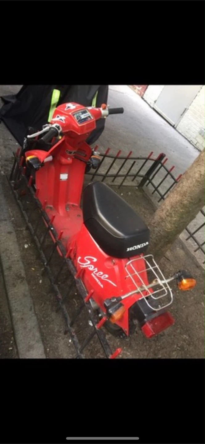 Collectible speed Honda red gas bike