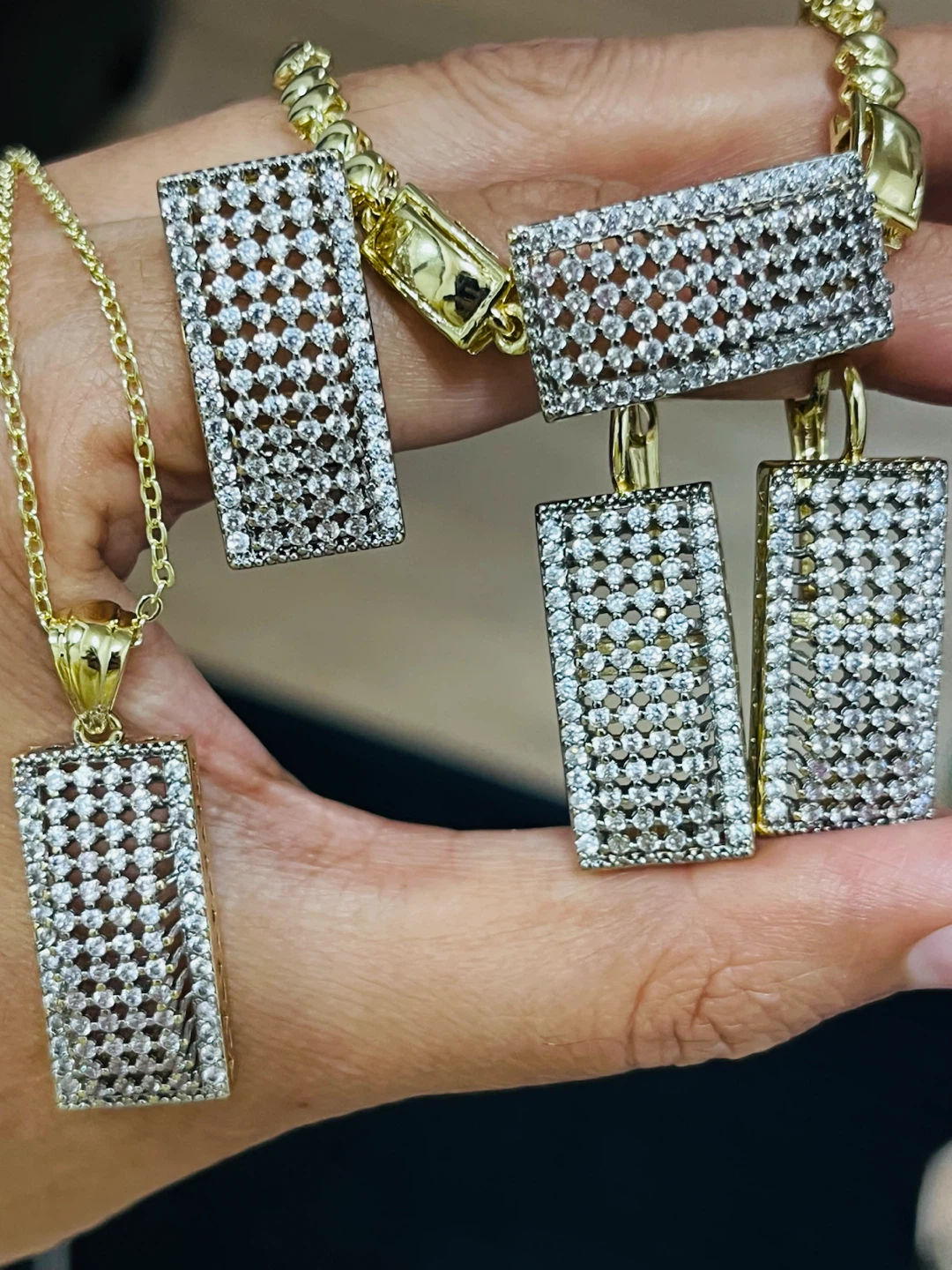 Gold-tone pendant necklace with matching earrings and bracelet