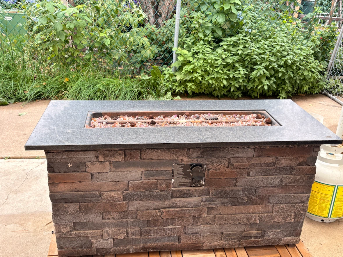 Fire table- Stone-Look Fire Pit with Glass Embers