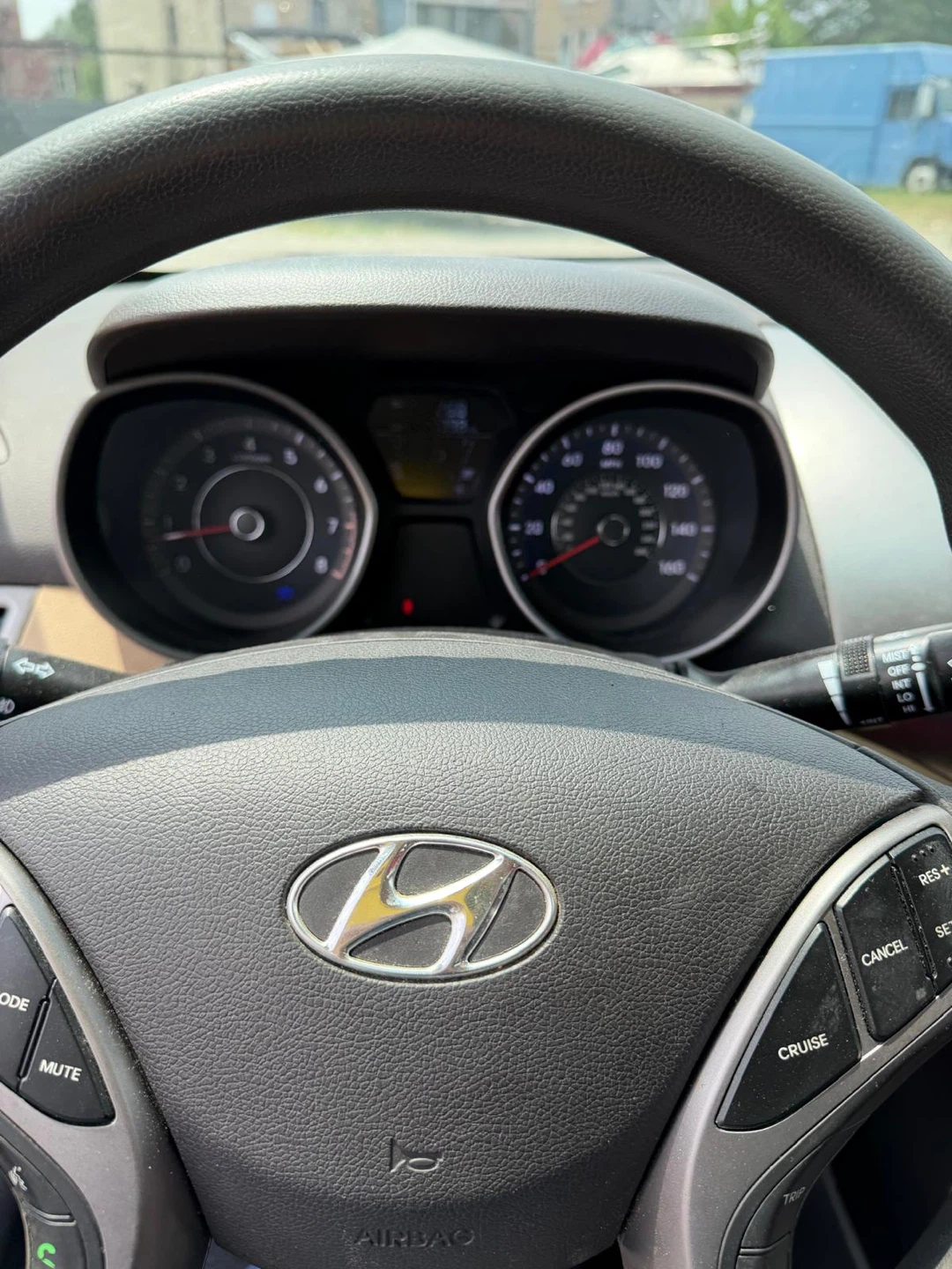 White Hyundai Elantra with Red and Black Seat Covers - photo 2