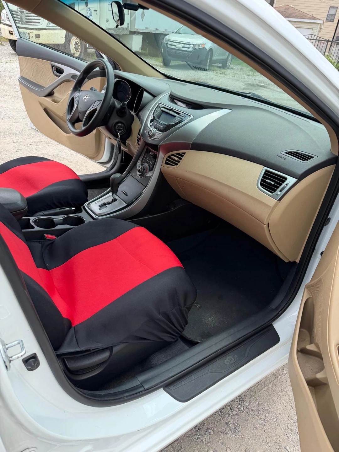 White Hyundai Elantra with Red and Black Seat Covers - photo 3