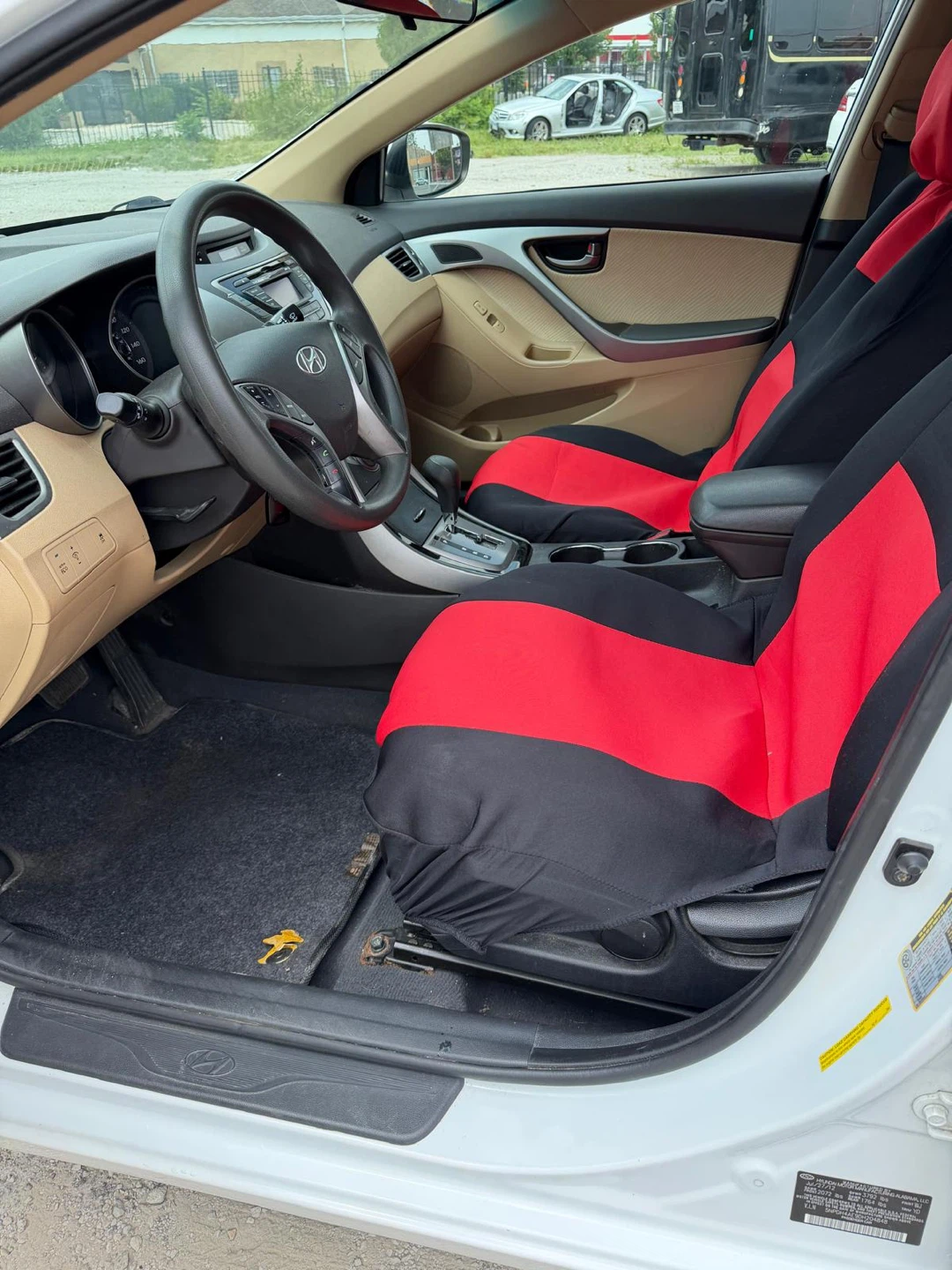 White Hyundai Elantra with Red and Black Seat Covers - photo 4