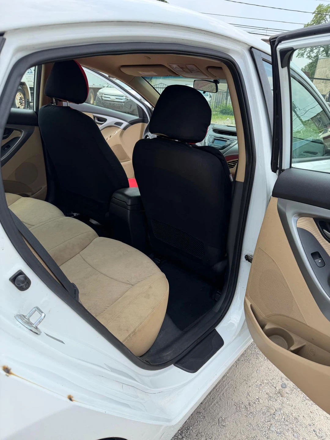 White Hyundai Elantra with Red and Black Seat Covers - photo 5