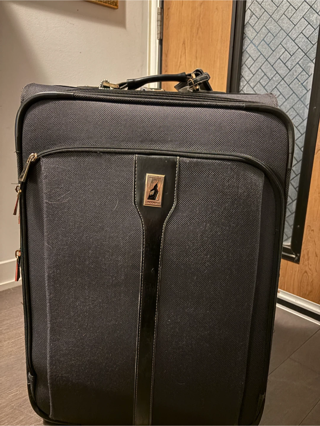 London Fog Luggage - Black Softside Spinner Suitcase