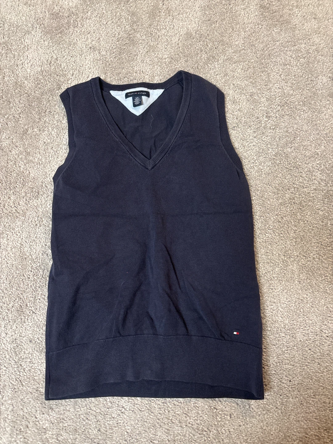 Dark blue sweater vest that’s full length