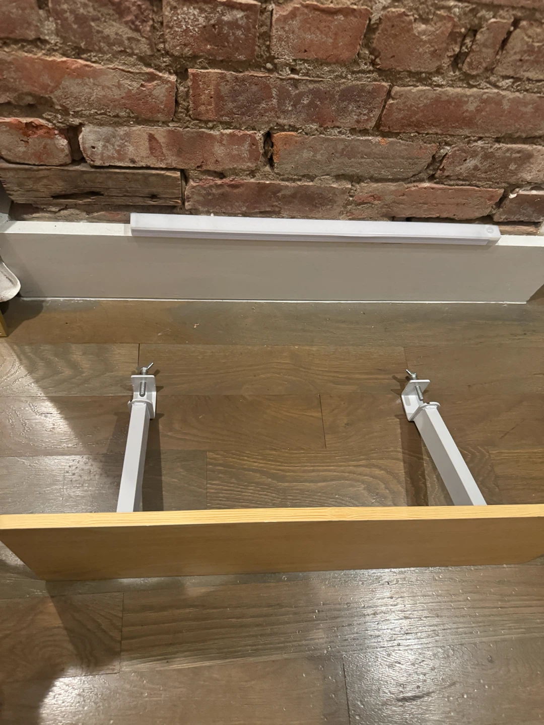 Wooden Shelf with White Brackets